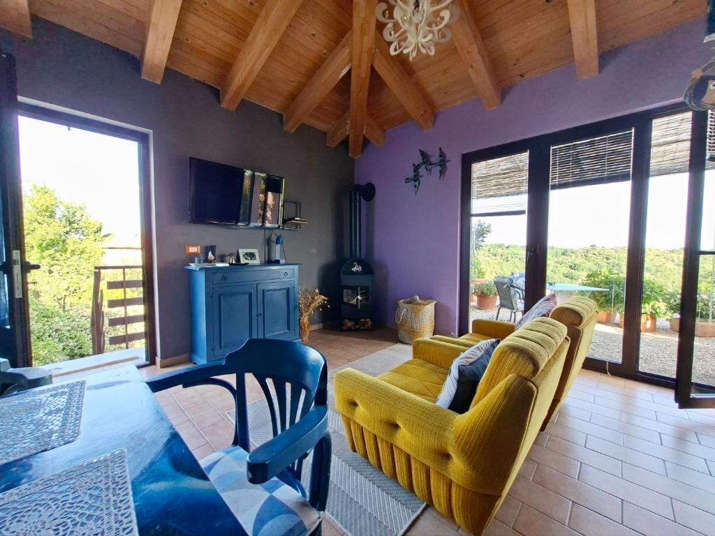 a living room with a couch and a table at Apartment Rosa Istria in Buje