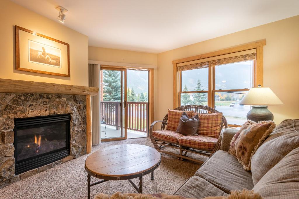 a living room with a couch and a fireplace at Copper Springs Lodge 107 in Copper Mountain