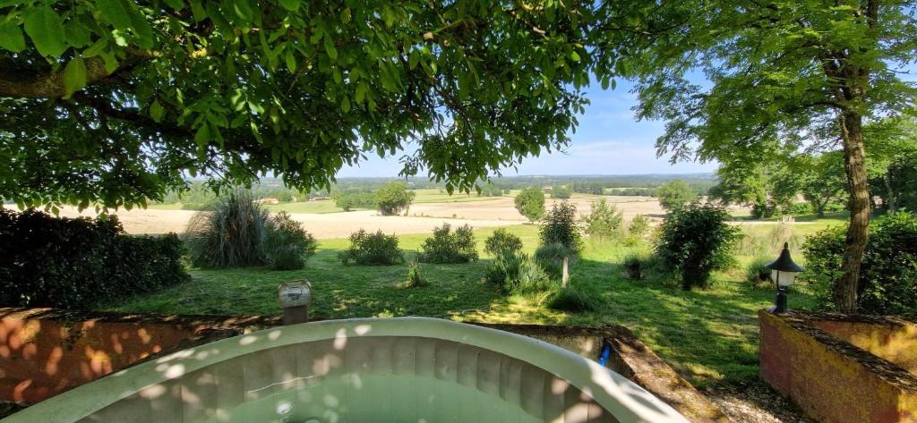 a view of a garden from the balcony of a house at Cezanne in Douzains