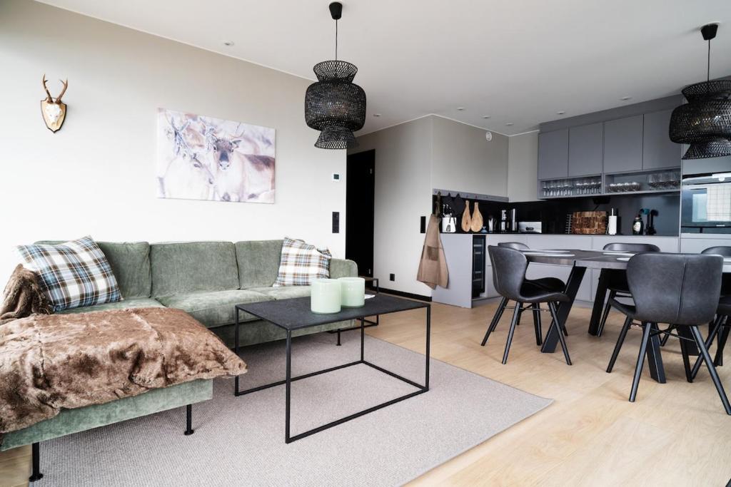 a living room with a couch and a table at View Apartments in Åre