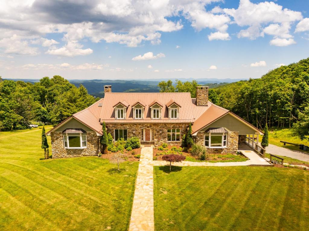 an aerial view of a house with a large yard at Appalachian Mountain Lodge in Boone