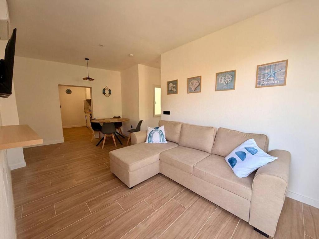 a living room with a couch and a table at Apartamento Torrox Village in Torrox