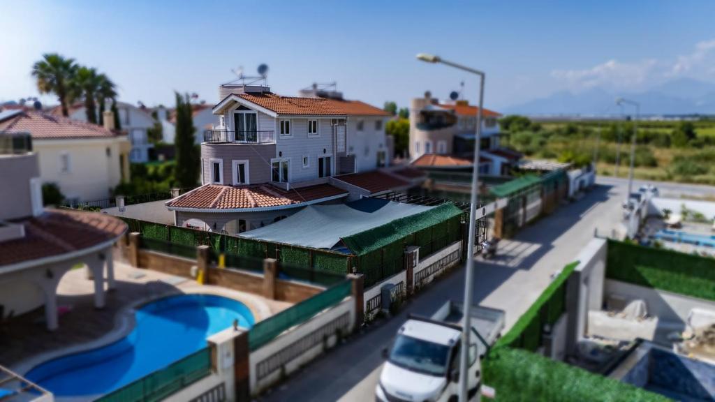 a view of a city with a house and a street at Villa ay yıldız in Belek