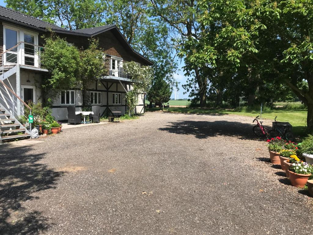 an empty driveway in front of a house at Askegaarden Apartments in Sandved