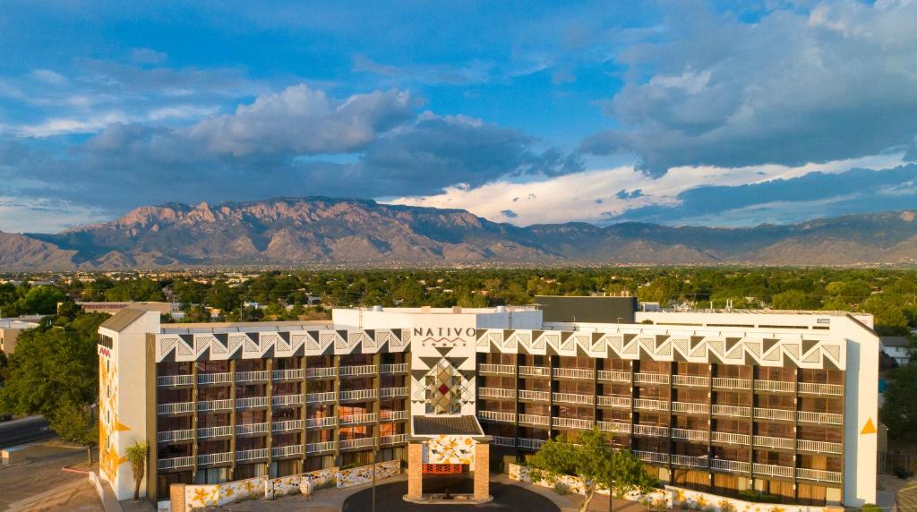 a view of a hotel with mountains in the background at Nativo Lodge in Albuquerque