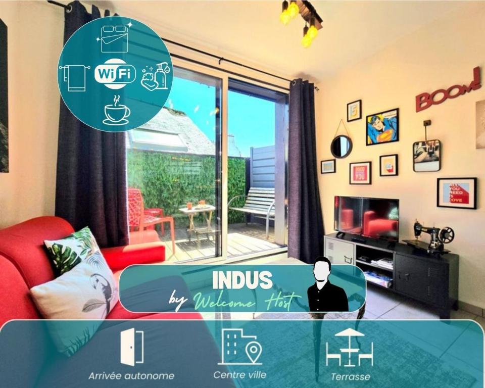 a living room with a red couch and a window at Indus, Confort en centre-ville in Vannes