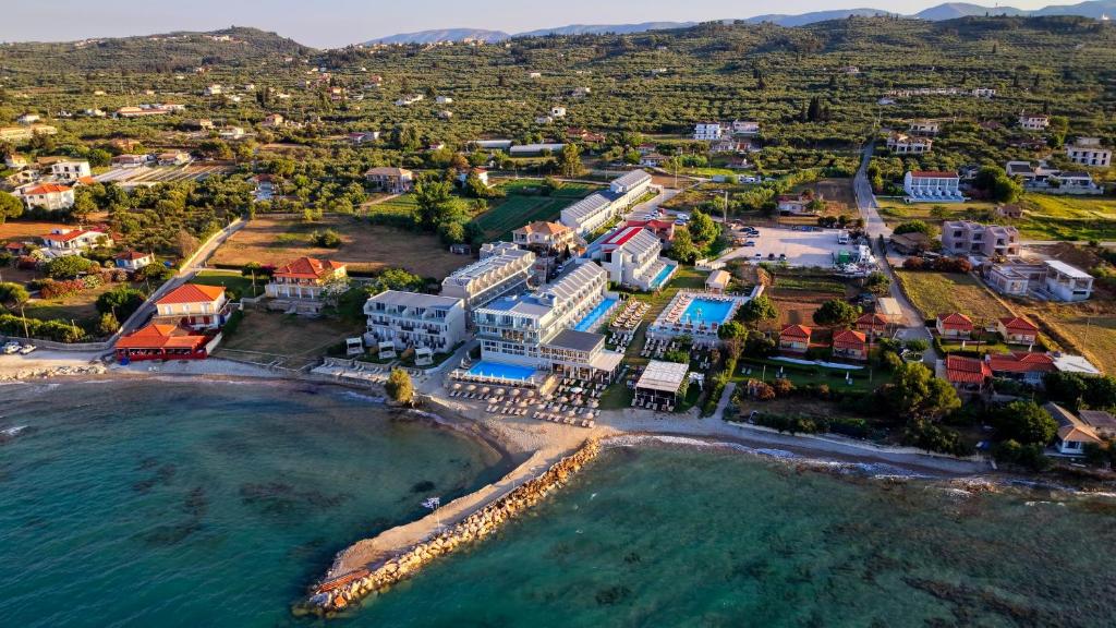 an aerial view of a resort on the beach at Golden Coast Beachfront Resort in Kypseli