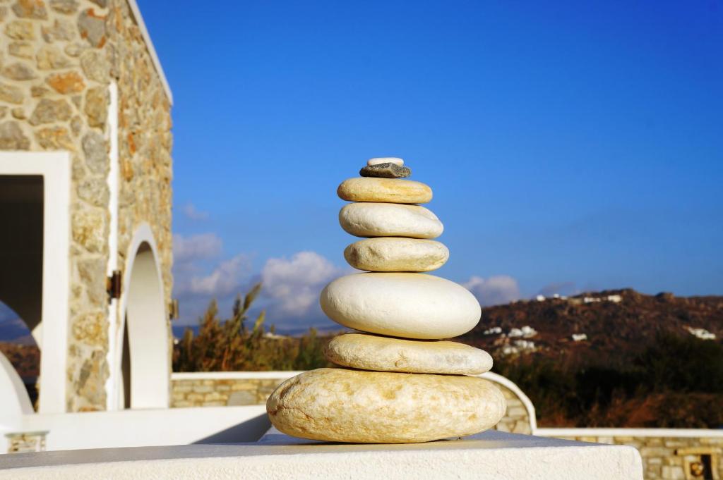 a stack of rocks stacked on top of each other at Blue Harmony Apartments in Plaka