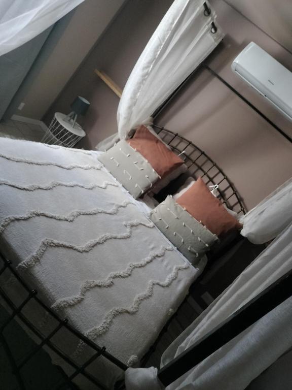 a bed in a hospital room with a mattressitures at La Trimouillaise in La Trimouille