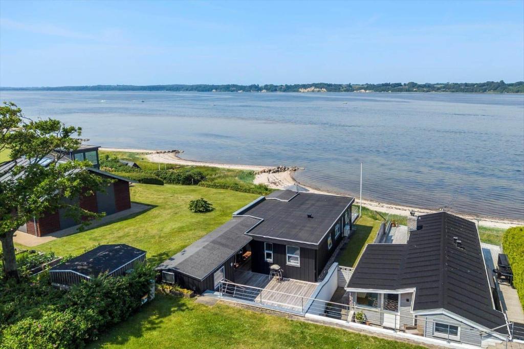 an aerial view of a house next to the water at LF15135-Farso-Strandvejen-35-B in Hvalpsund