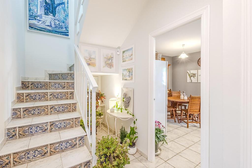 a staircase in a home with blue and white tiles at De la Danza in Seville