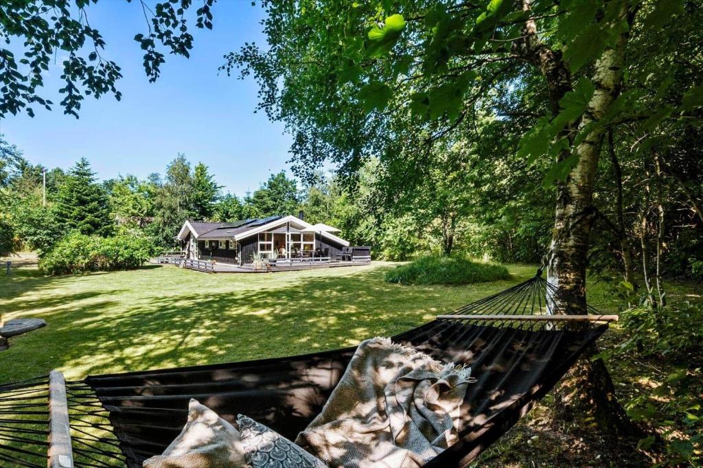a hammock in front of a house in a yard at JB274-Fjerritslev-Ronnevej-10 in Kollerup