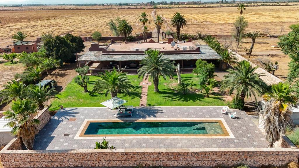 an aerial view of a house with a swimming pool at Villa Dar Luz in Marrakesh
