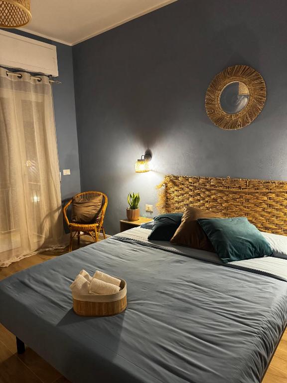 a bedroom with two beds and a mirror on the wall at Casa Agata in Chioggia