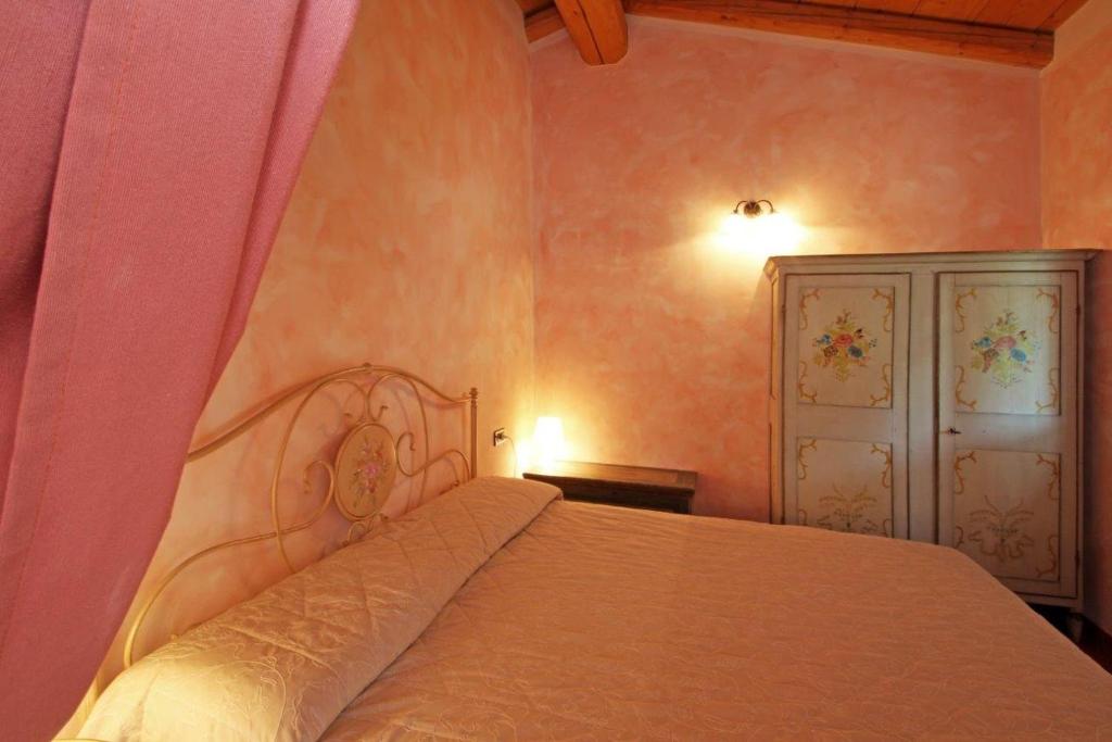 Postel nebo postele na pokoji v ubytování Cascina Le Preseglie
