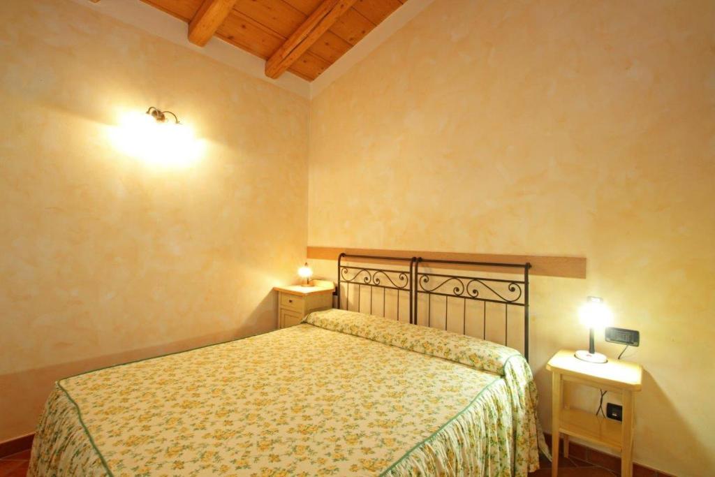 Postel nebo postele na pokoji v ubytování Cascina Le Preseglie