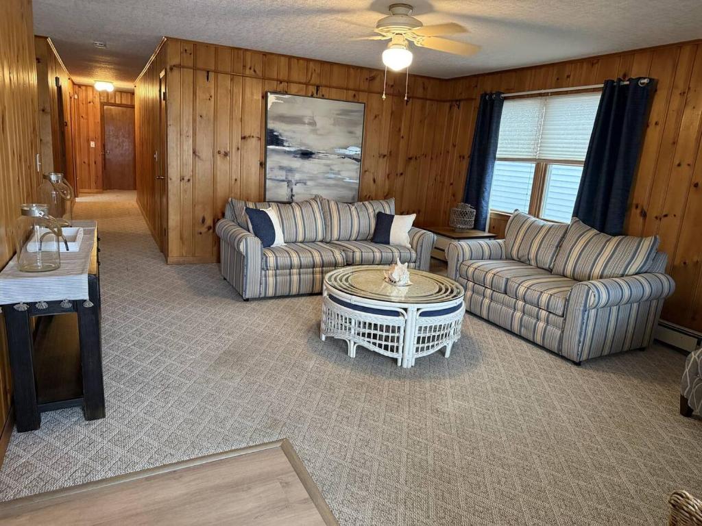 a living room with two couches and a coffee table at Between Tides 3BR Walk to Beach Unit D in Seaside Park