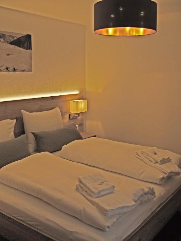 Postel nebo postele na pokoji v ubytování Mammhofer Suite & Breakfast
