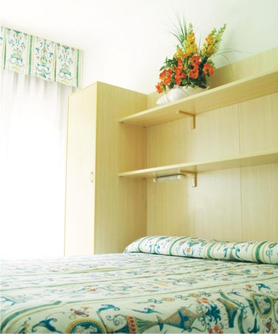 Postel nebo postele na pokoji v ubytování Hotel Fabris