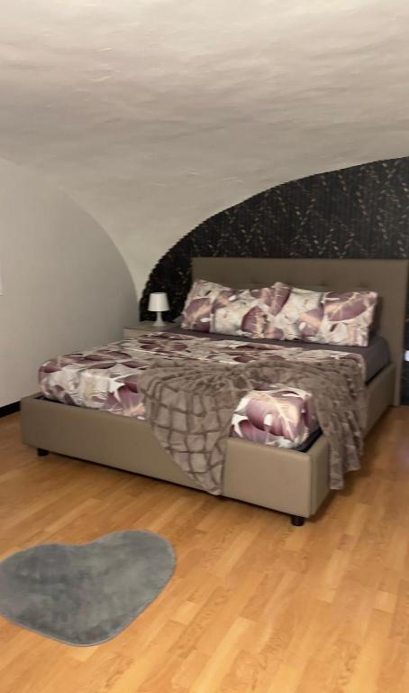 a bedroom with a bed and a rug at AG Scalo d amore house in Naples