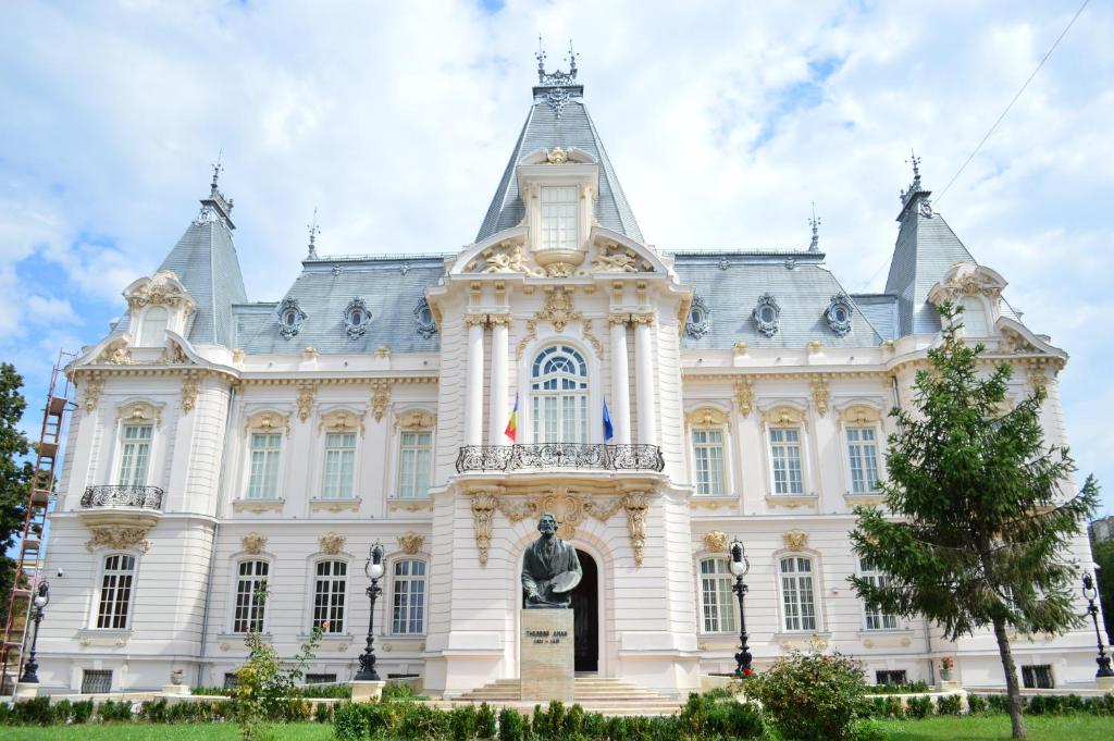 a large white building with a tower at AleA Central Studio Art Museum in Craiova