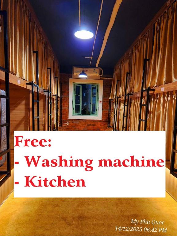 a room with a sign that reads free washing machine kitchen at Mi Amor Luxury Hostel located in South Island Center in Phú Quốc