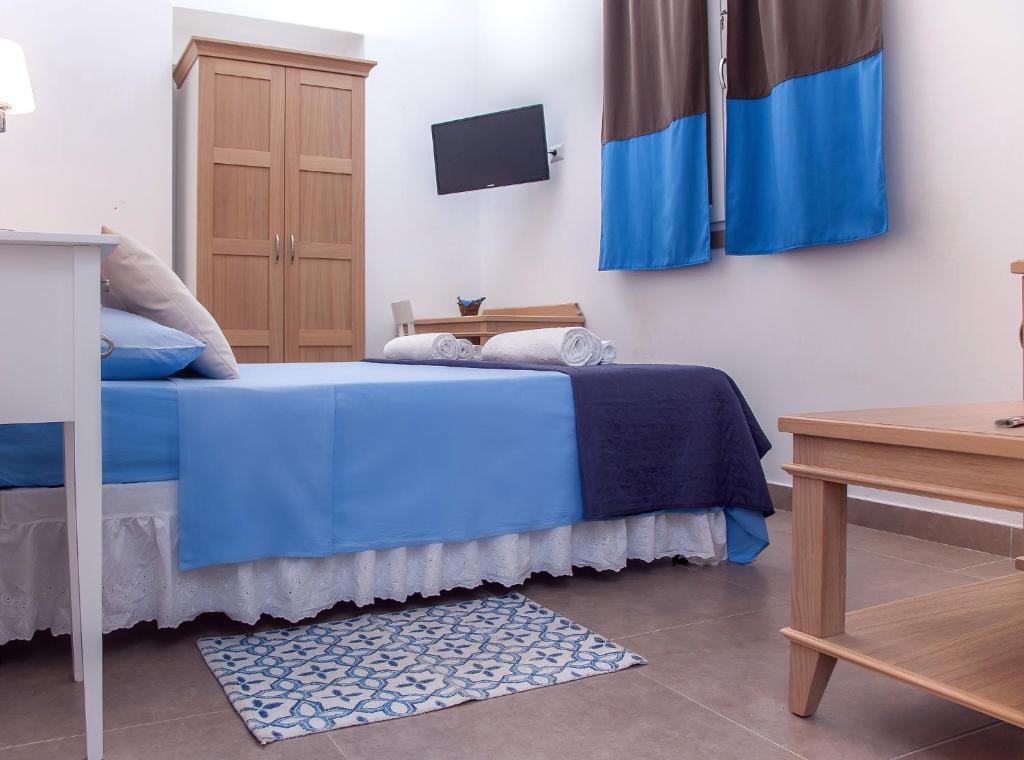 Postel nebo postele na pokoji v ubytování Feudo d'Arneo