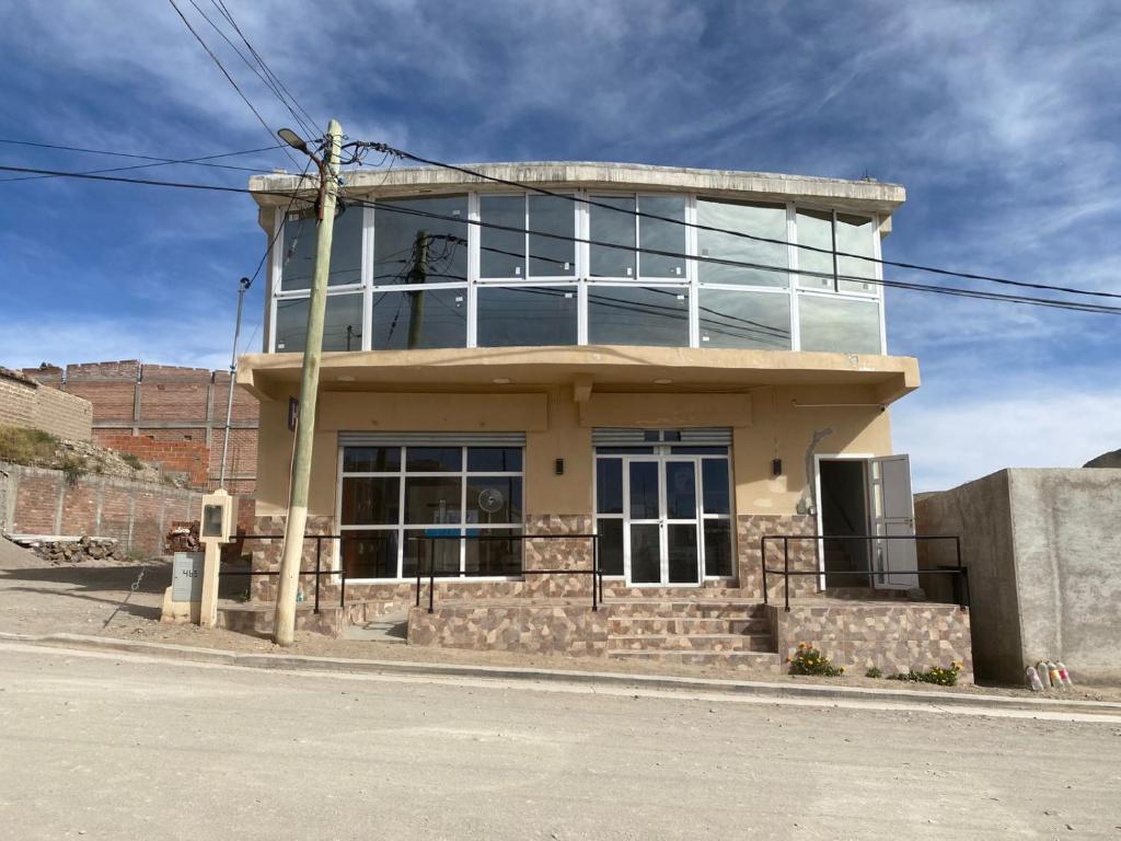 a building on the side of a street at Hotel Altos de la Puna in San Antonio de los Cobres