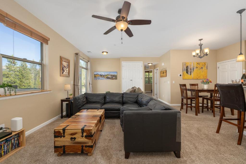 a living room with a couch and a ceiling fan at Timbers 9-4 in Fraser