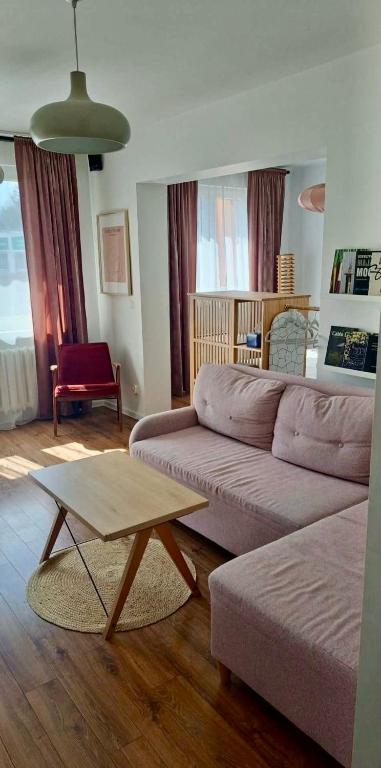 a living room with a couch and a coffee table at M37 Apartment Limanowa Beskid Base in Limanowa