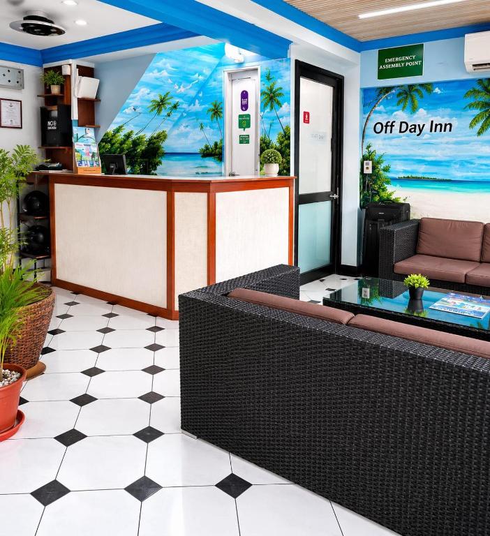 a lobby with a waiting area with aoc day inn at Off Day Inn in Male City