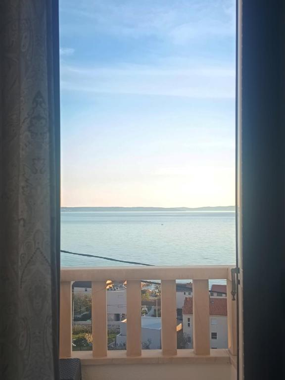 a view of the ocean from a window at La Diva Adriatica in Podstrana