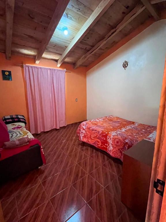 a bedroom with a bed and a window in it at El rinconcito in Omitlán de Juárez