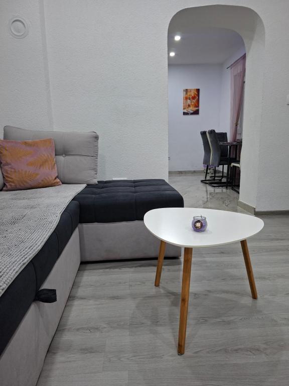a living room with a couch and a table at Apartman Edwin Jajce in Jajce