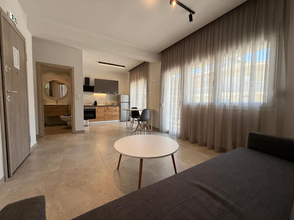 a living room with a couch and a table at K78 Studios B1 in Nea Michaniona