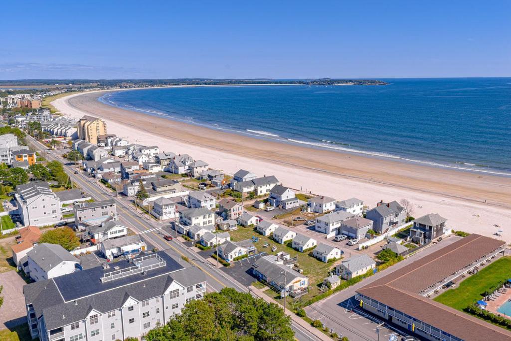an aerial view of a beach with houses and the ocean at Little Miss Cottages - Studio in Old Orchard Beach
