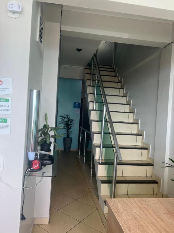 a staircase in an office building with a stair case at Hotel Pará Santarém PA in Santarém