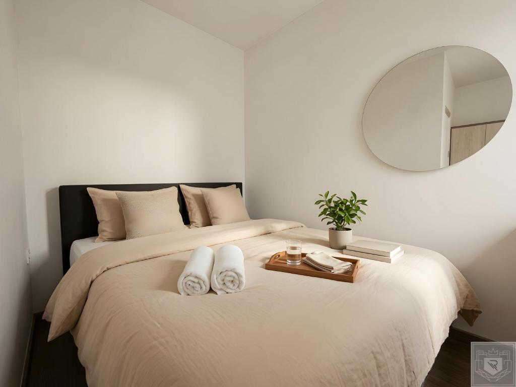 a bedroom with a large bed with a mirror at RentHouse Apartments-Old Town Studio #2 in Chişinău