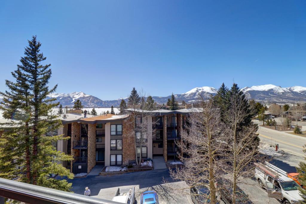 an apartment building with snow covered mountains in the background at 432 Marina Place in Dillon