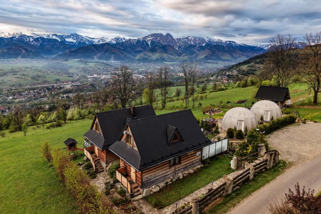 an aerial view of a home with tents and mountains at Domki Widokowe Wooden Pod Gubałówką z Jacuzzi in Ząb