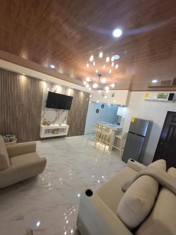 a living room with a couch and a table at Paradise 1 in Jacó