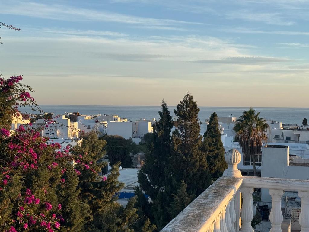a view of a city from a balcony at Vue Mer in Hammamet Nord