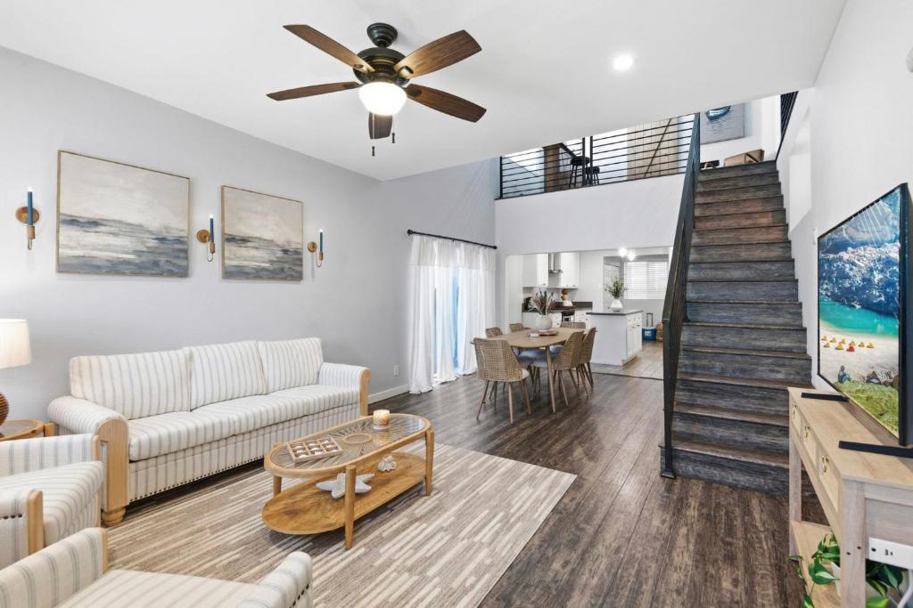 a living room with a couch and a table at Casa Playa Long Beach in Long Beach