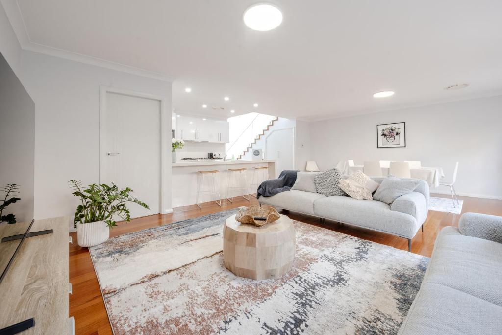 a living room with a couch and a table at Kookora Suites in Griffith