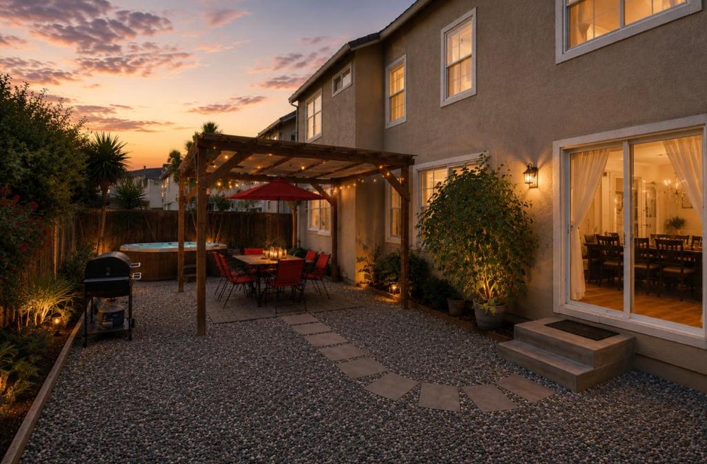 a patio with a table and a grill in front of a house at Healdsburg Winemaker's Home in Windsor