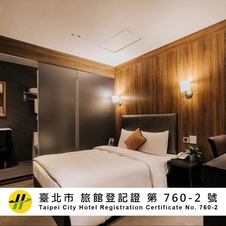 a hotel room with a bed in a room at Meworld Hotel - Taipei Main Station in Taipei