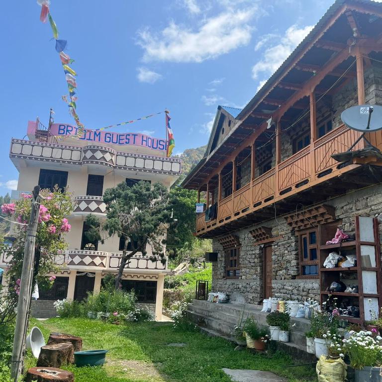 a building with a sign that reads be my guest house at Briddhim Guest House in Syābru Bensi