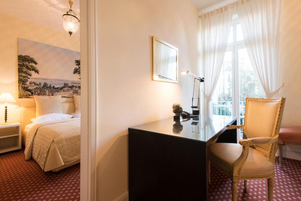 Cama ou camas em um quarto em DIRAZI Guesthouse & Apartments GmbH