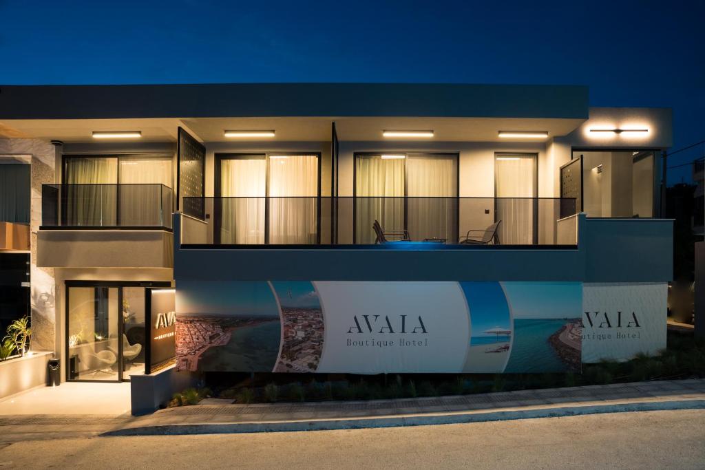 a large building with a sign on the side of it at AVAIA boutique hotel in Nea Moudania