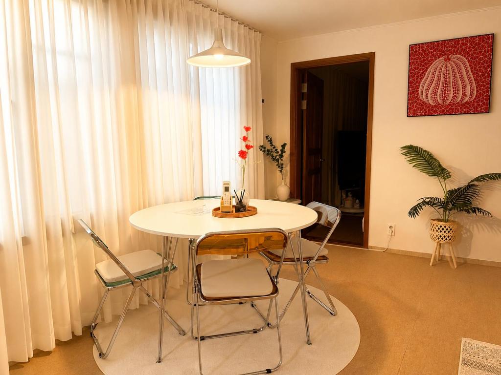 a room with a table and chairs in a room at Stay U in Suwon